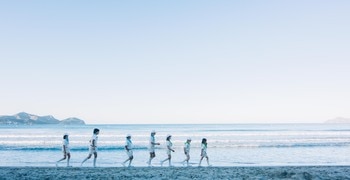 a group of people on a beach