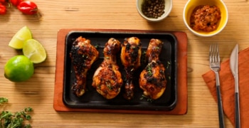 a bunch of food sitting on top of a wooden table