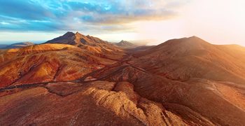 a canyon with a mountain in the background