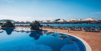 a pool next to a body of water