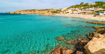 a beach with rocks and water
