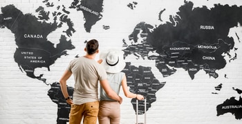 a man and woman looking at a map
