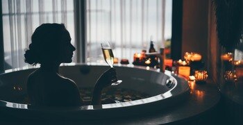 a person sitting in a bathtub